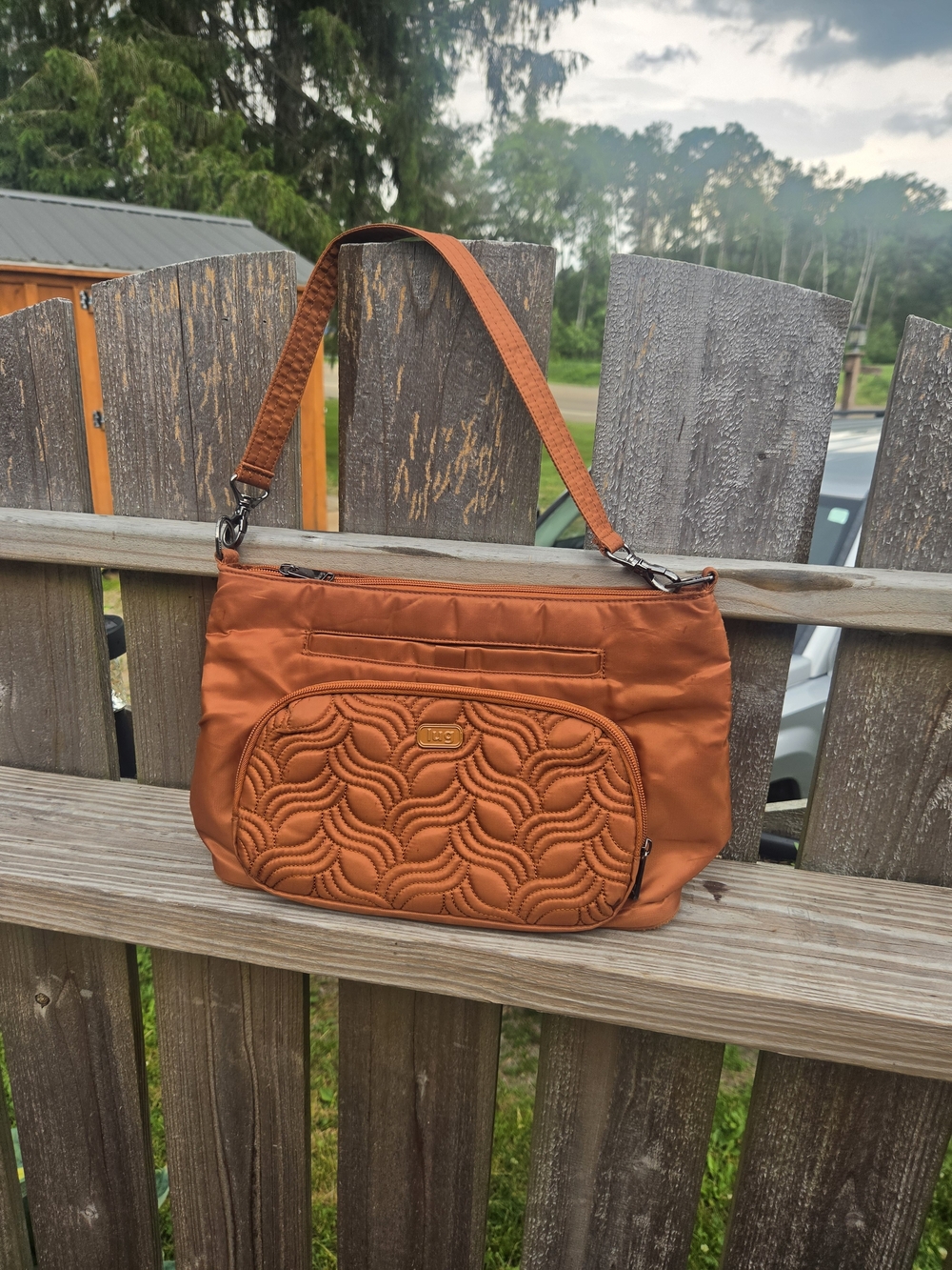 This item is the Lug Samba XL Convertible Crossbody Bag in the Copper Brown